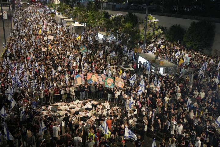 People protest against Israeli Prime Minister Benjamin Netanyahu's government and call for the ...