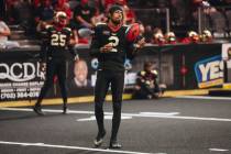 Knight Hawks quarterback Ja’Rome Johnson (2) tosses the ball with a teammate during half ...