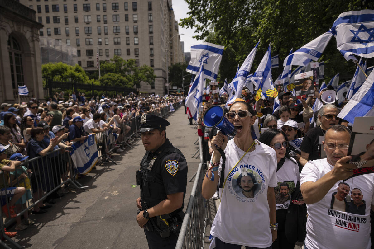 Participants march during the annual Israel Day Parade on Fifth Avenue on Sunday, June 2, 2024, ...