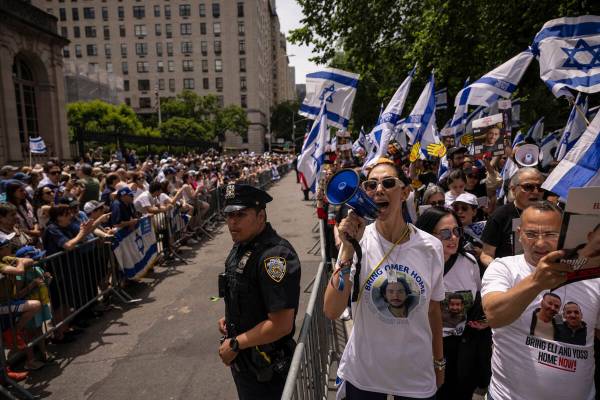 Participants march during the annual Israel Day Parade on Fifth Avenue on Sunday, June 2, 2024, ...