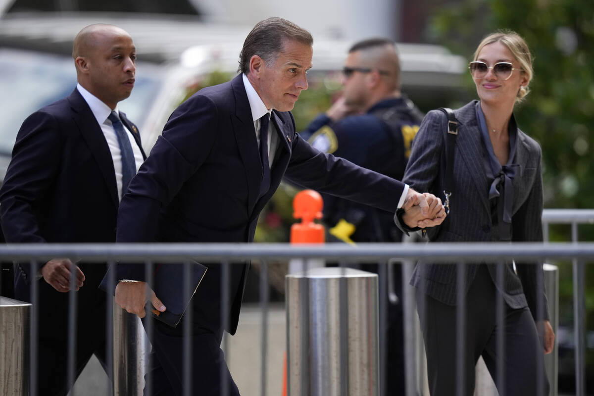 Hunter Biden, center, and his wife, Melissa Cohen Biden, right, arrives at federal court, Monda ...