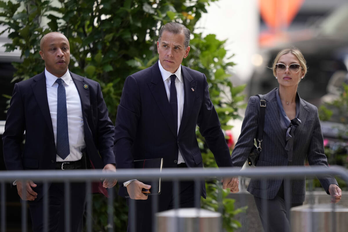 Hunter Biden, center, and his wife, Melissa Cohen Biden, right, arrive at federal court, Monday ...