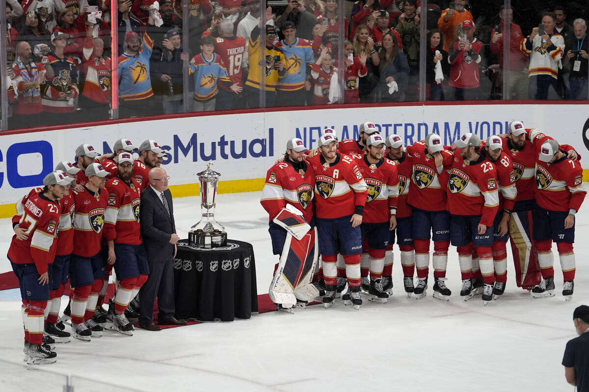 The Florida Panthers pose with the Prince of Wales Trophy after defeating the New York Rangers ...