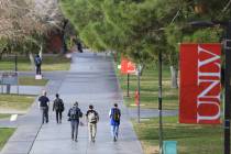 Students walk along a sidewalk at UNLV. (Las Vegas Review-Journal)