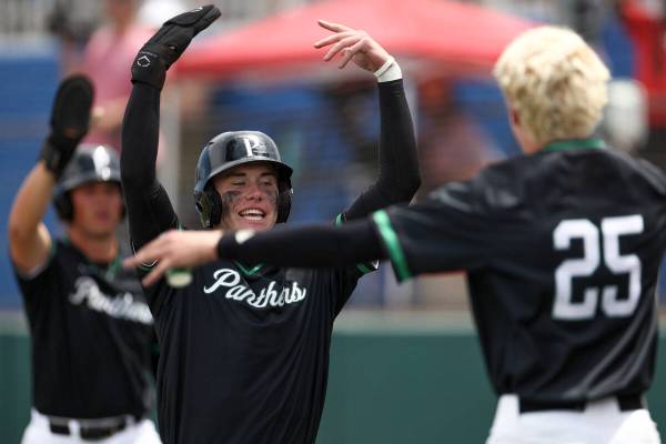 Palo Verde infielder Drew Kaplan (15) celebrates after scoring during a Class 5A baseball state ...