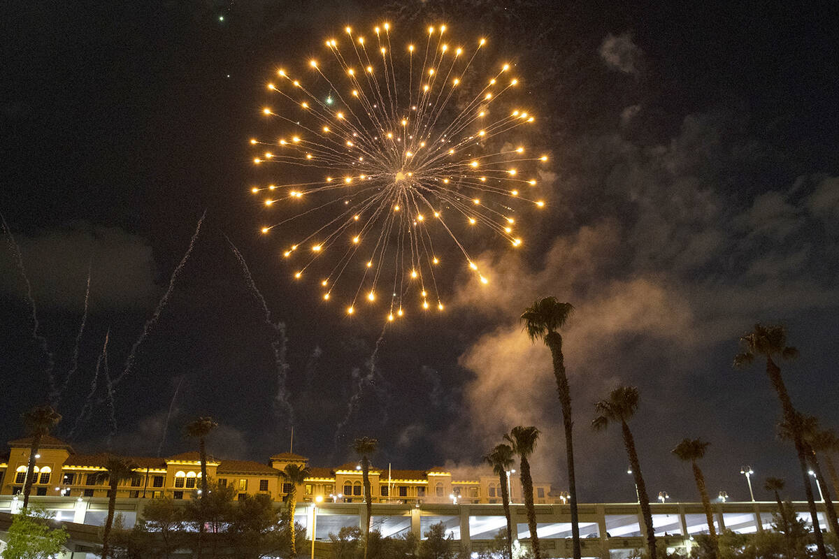 Fireworks go off above the Green Valley Ranch, on Sunday, July 4, 2021, in Henderson. (Bizuayeh ...