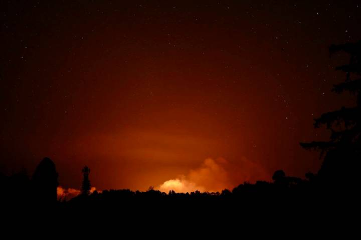 This image provided by the U.S. Geological Survey, seen from the Volcano Golf Course, shows a p ...