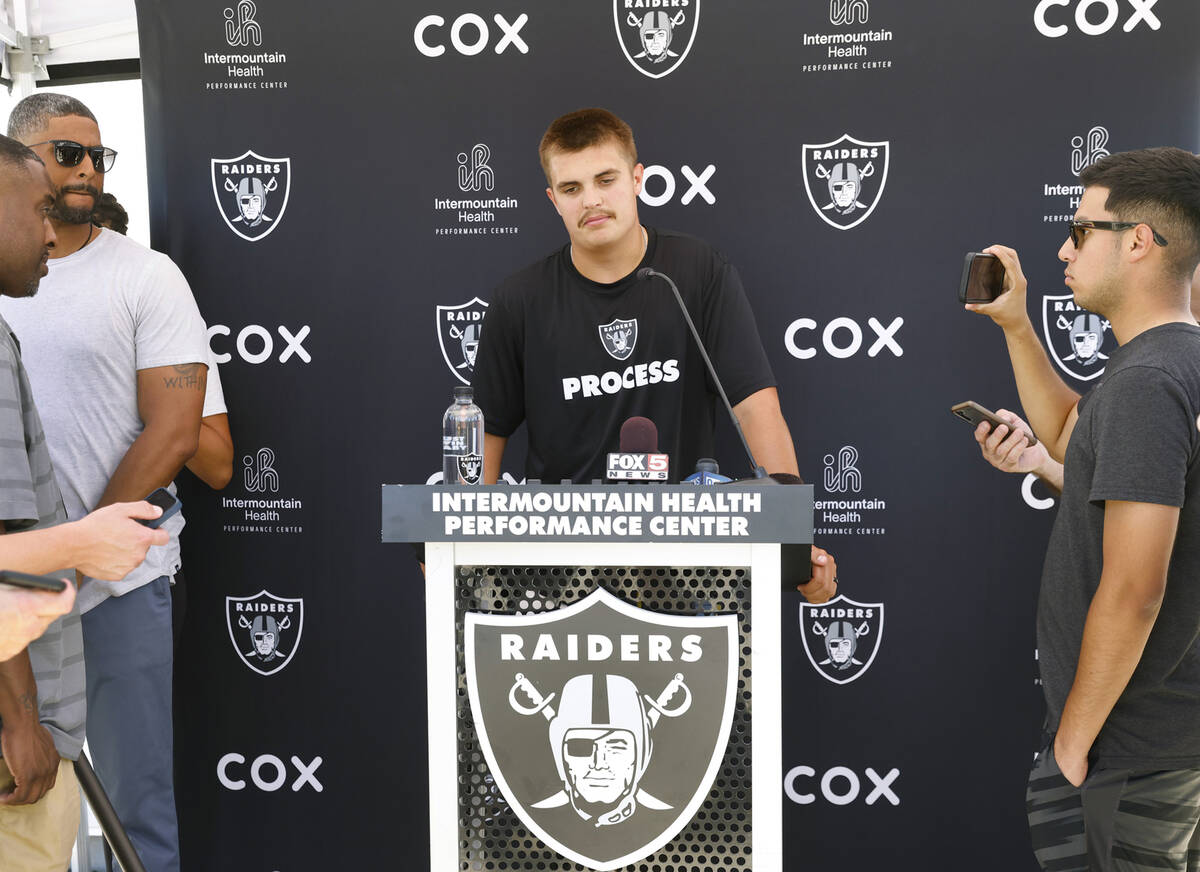 Raiders quarterback Aidan O'Connell (12) pauses as he addresses the media after organized team ...