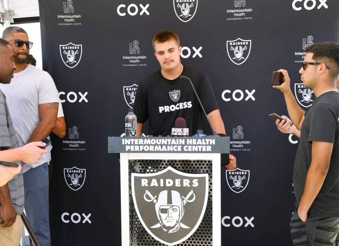 Raiders quarterback Aidan O'Connell (12) pauses as he addresses the media after organized team ...