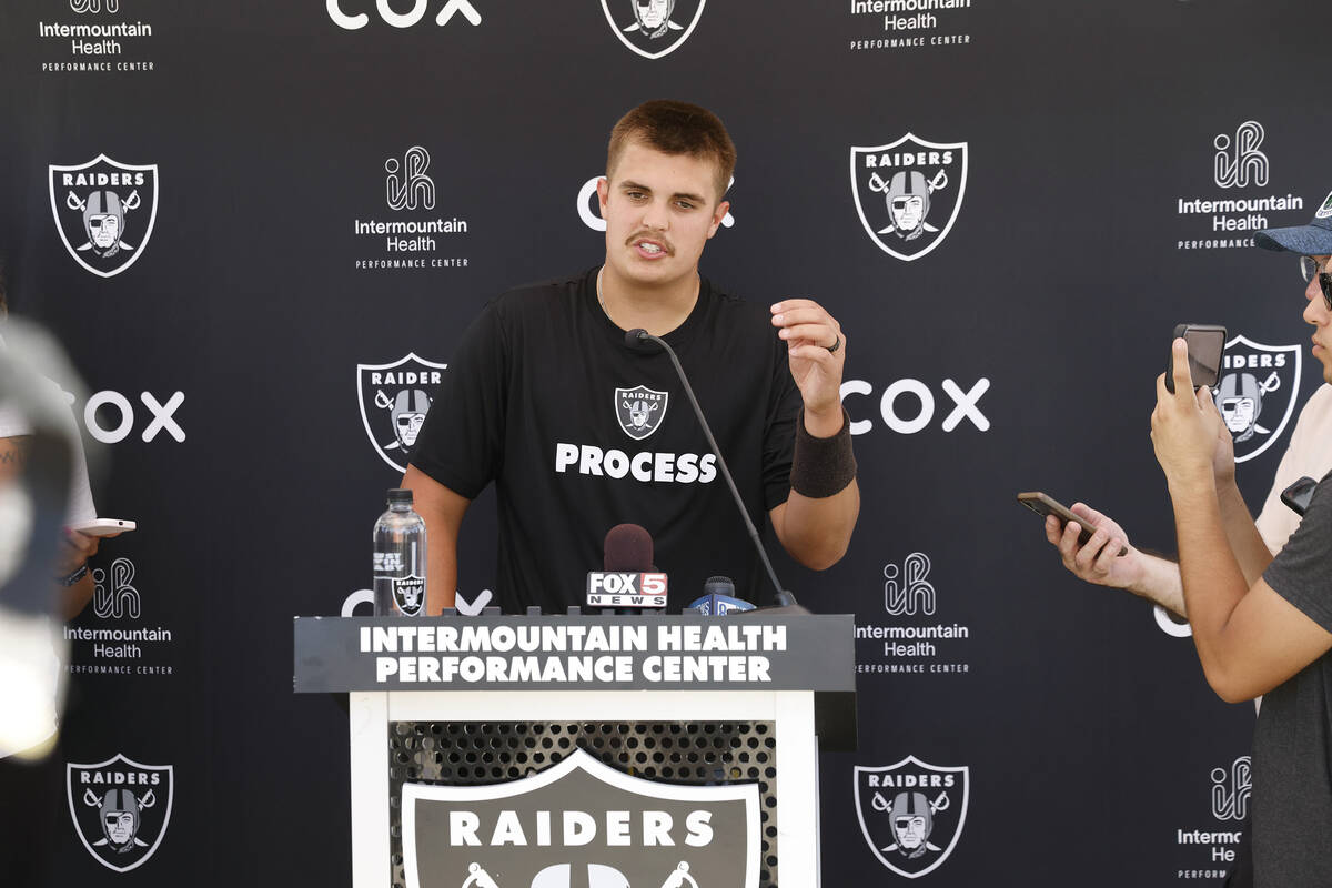Raiders quarterback Aidan O'Connell (12) addresses the media after organized team activities at ...