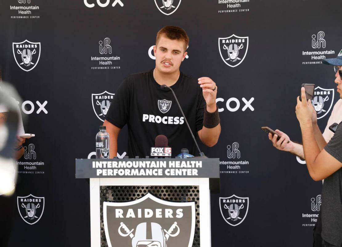 Raiders quarterback Aidan O'Connell (12) addresses the media after organized team activities at ...