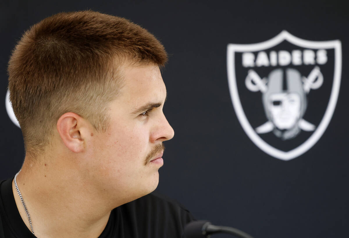 Raiders quarterback Aidan O'Connell listens to reporters questions as he addresses the media af ...