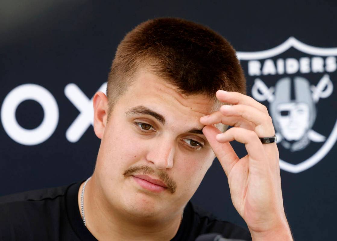 Raiders quarterback Aidan O'Connell pauses as he addresses the media after organized team activ ...