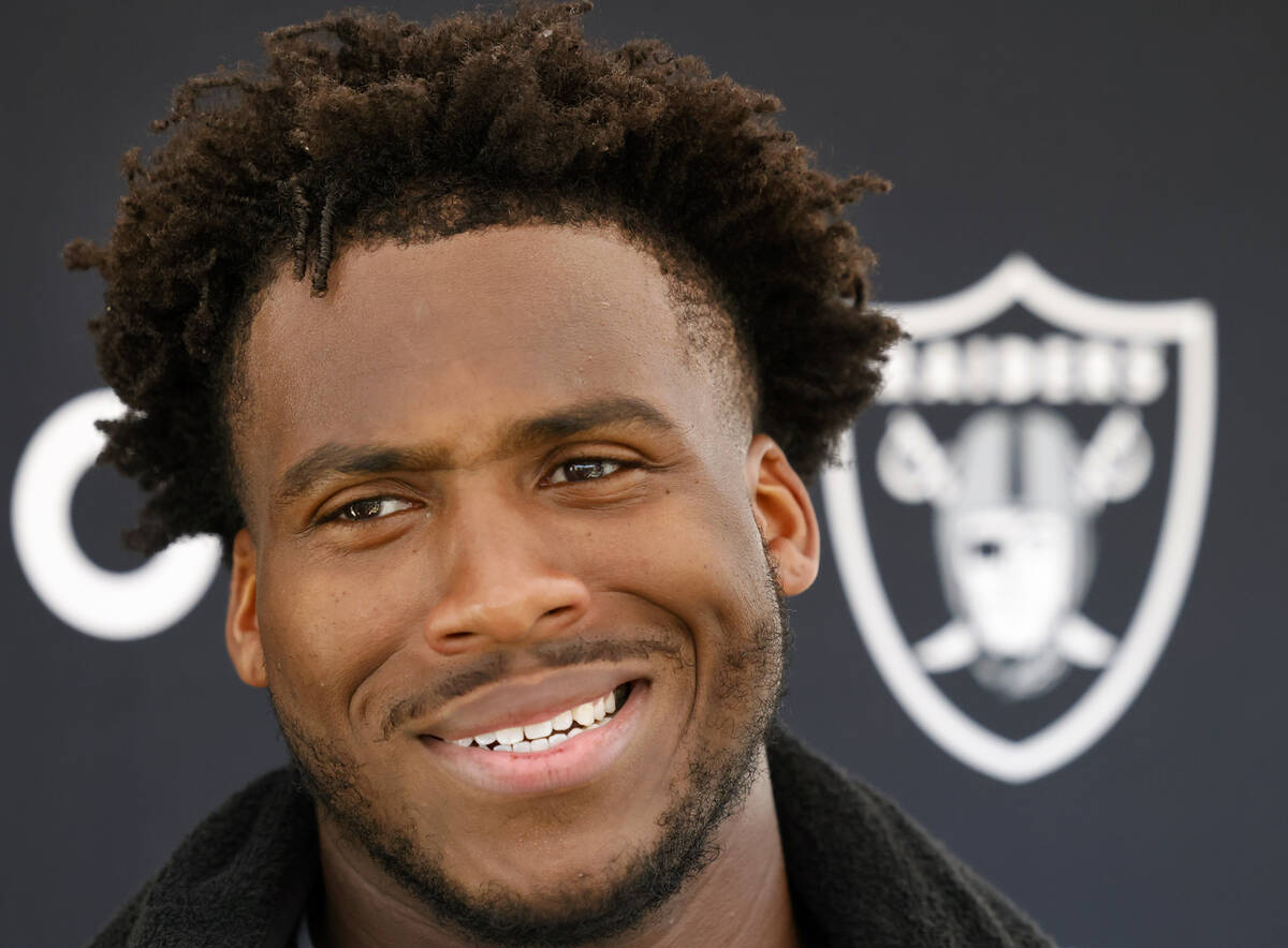Raiders team's defensive end Malcolm Koonce smilies as he addresses the media after organized t ...