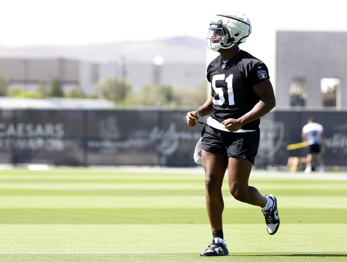 Raiders team's defensive end Malcolm Koonce takes the field to participate in organized team ac ...