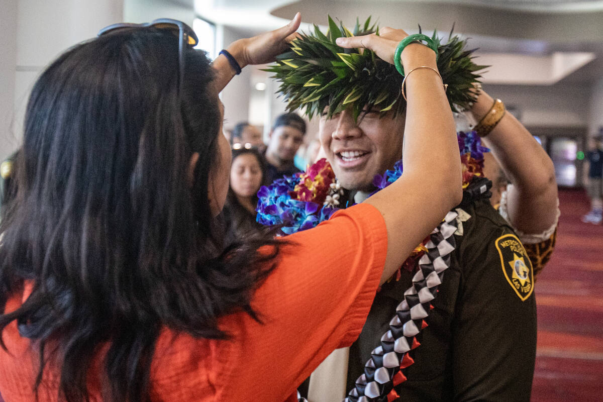 Graduate Raymond FIame is presented with a tea leaf haku after the Las Vegas Metro Police Depar ...