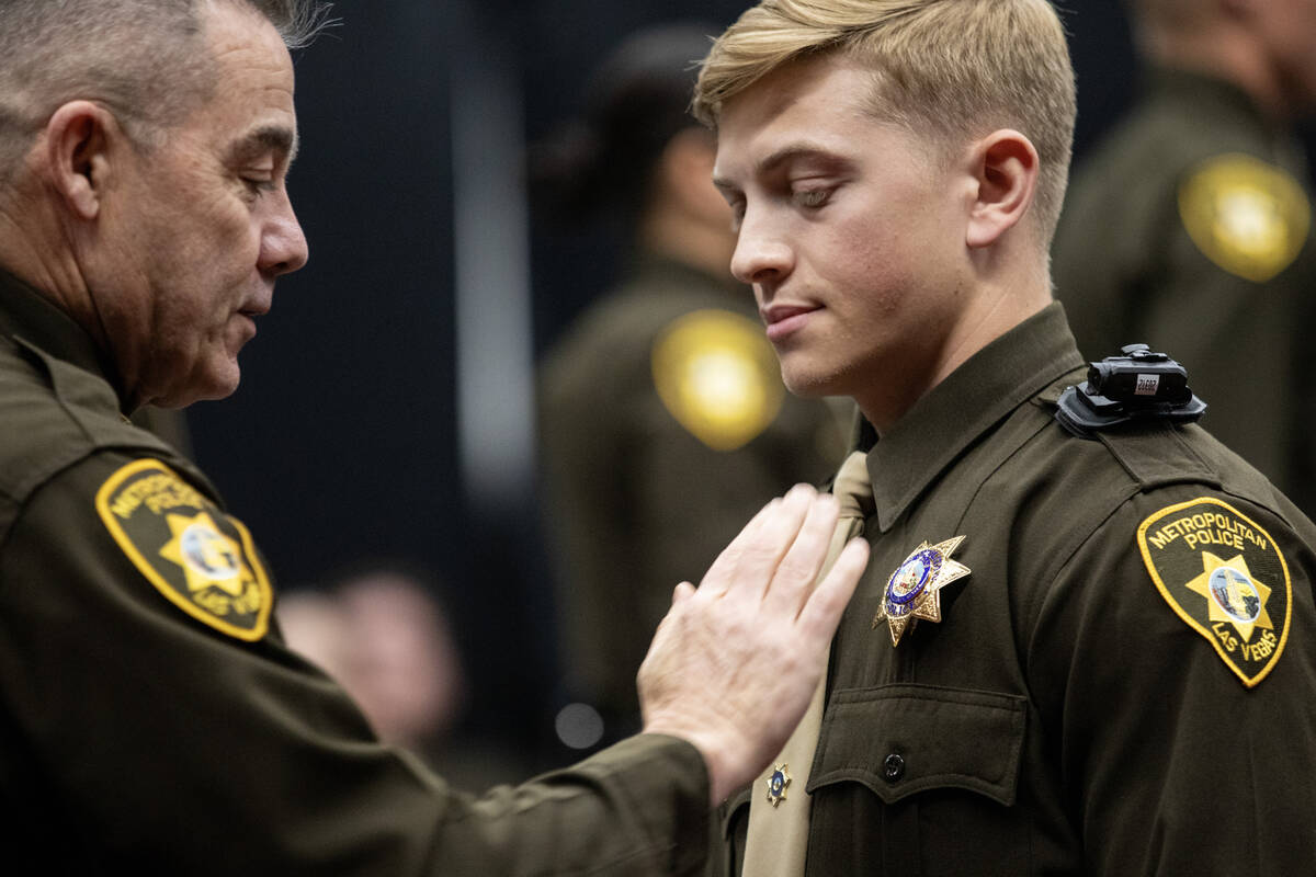 Graduates receive their badge and diplomas during the Las Vegas Metro Police Department Police ...