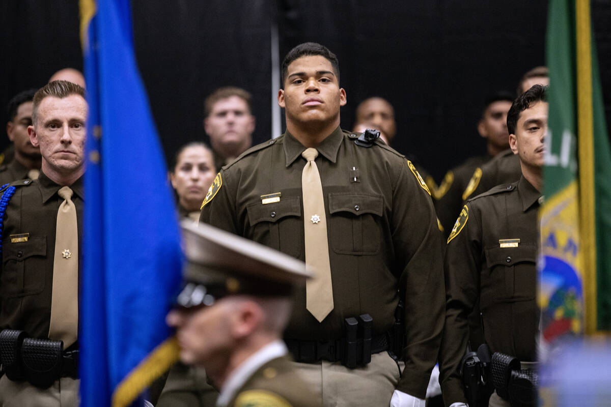 Members of the Las Vegas Metro Police Department Police Academy Class 11-2023 stand for the pre ...