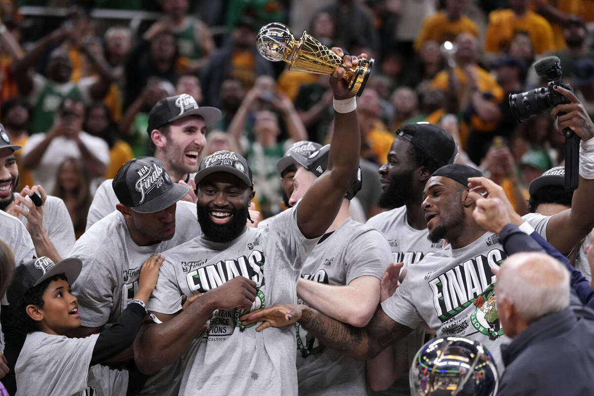 Boston Celtics guard Jaylen Brown, center, celebrates with his teammates after Game 4 of the NB ...