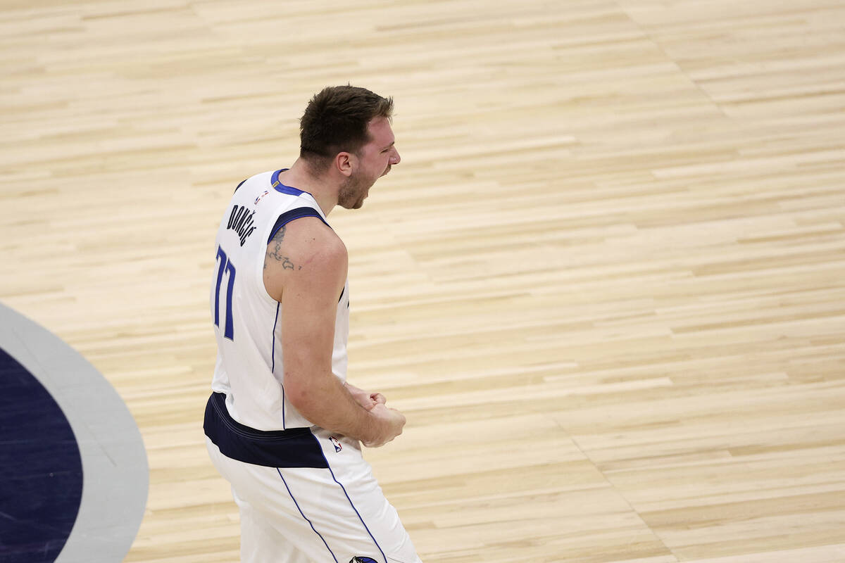 Dallas Mavericks guard Luka Doncic celebrates his 3-pointer against the Minnesota Timberwolves ...