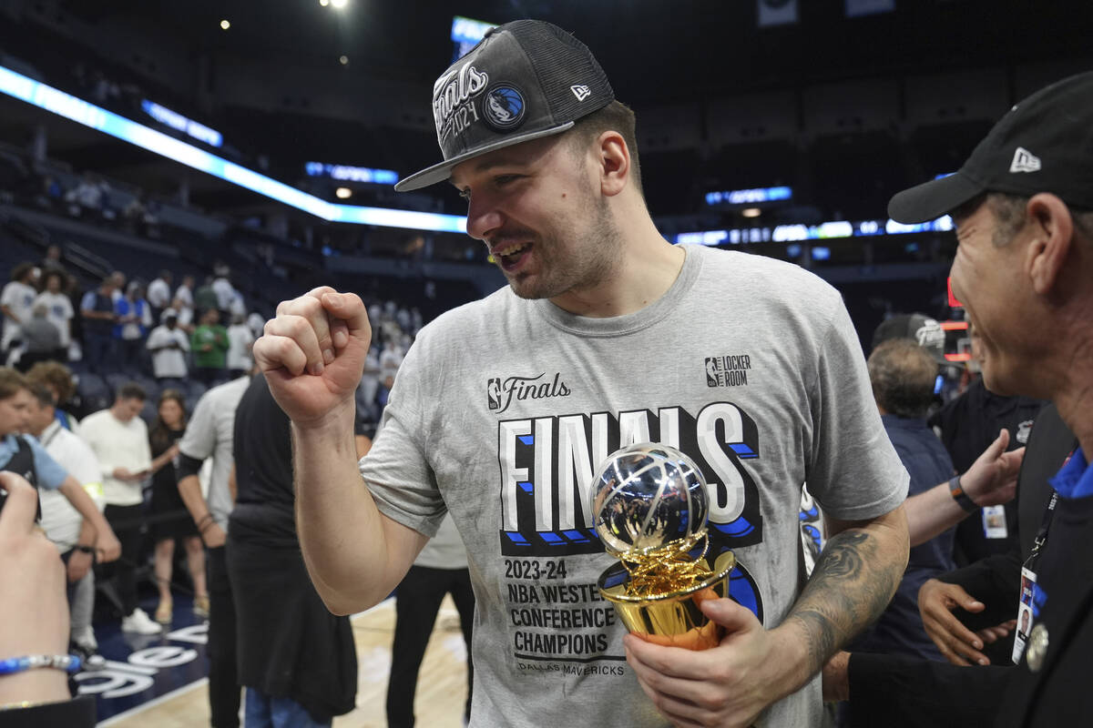 Dallas Mavericks guard Luka Doncic celebrates the team's win over the Minnesota Timberwolves in ...