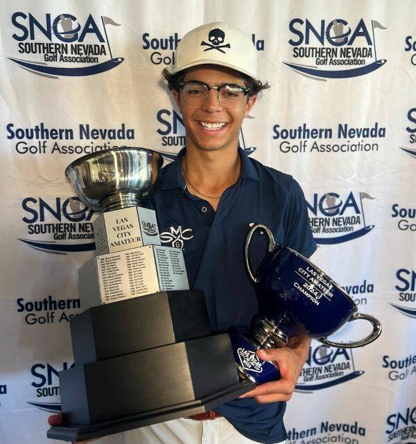 Avery Lazarski holds his trophies after winning the Las Vegas City Amateur for the second conse ...