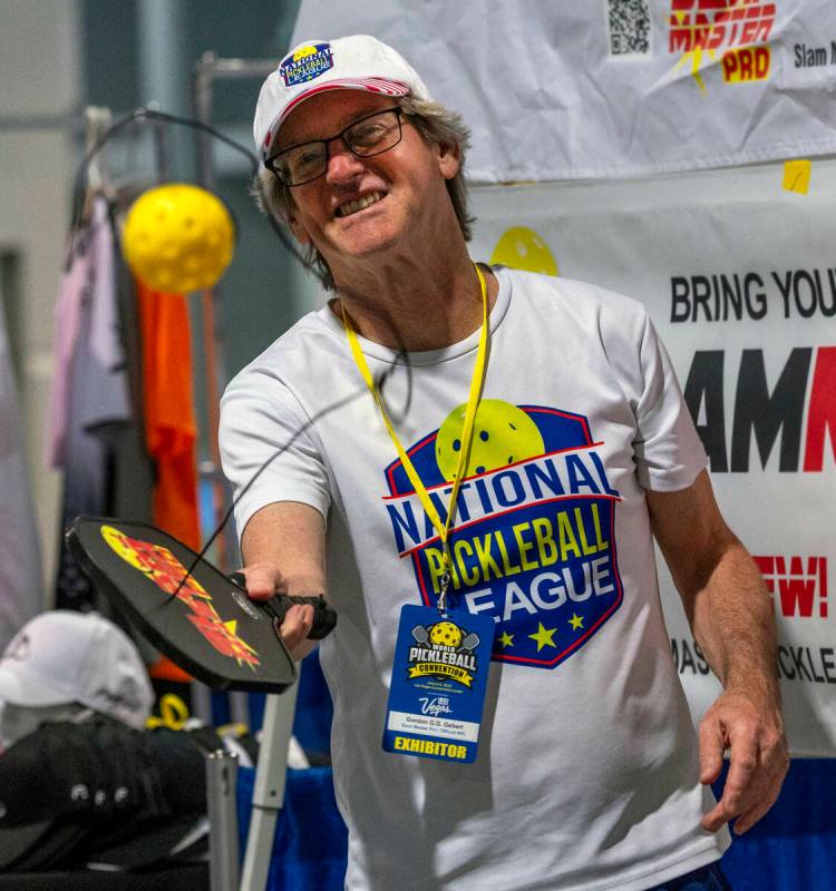 Gordon Gebert demonstrates his Slam Master Pro pickleball training paddle during the World Pick ...