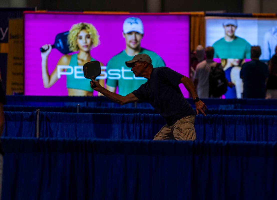 An attendee tests a new paddle on a practice court during the World Pickleball Convention withi ...