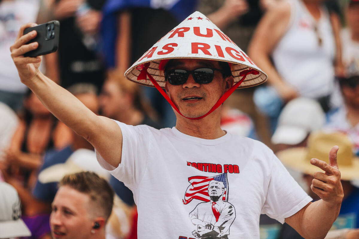 A supporter takes a video while waiting for former President Donald Trump to speak at a rally a ...