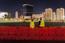 Gino Catania, left, and his cousin Vinny Catania wait on a barrier for the implosion of the rem ...