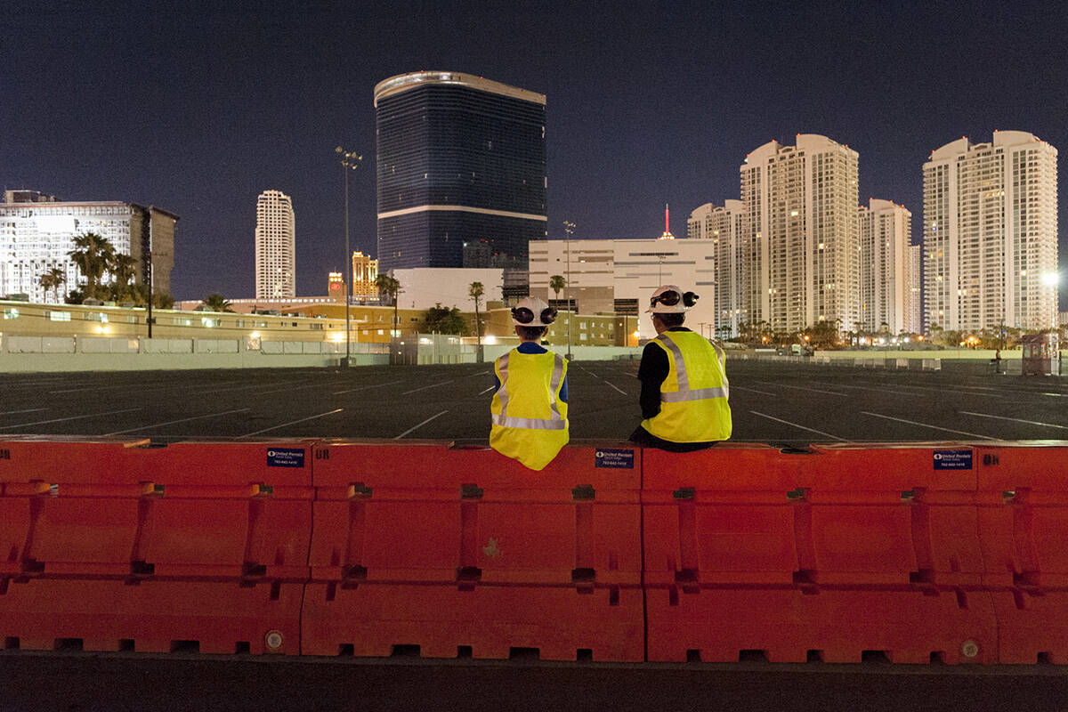 Gino Catania, left, and his cousin Vinny Catania wait on a barrier for the implosion of the rem ...