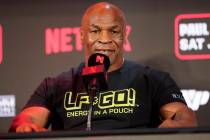 FILE - Mike Tyson speaks during a news conference promoting his upcoming boxing bout against Ja ...