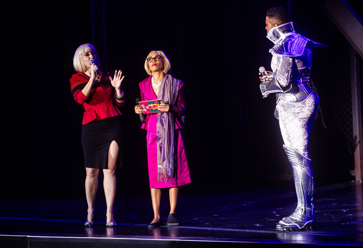 Hosts Lola Van Ella, left, and Jeez Loueez talk with performer and reigning Miss Exotic World S ...