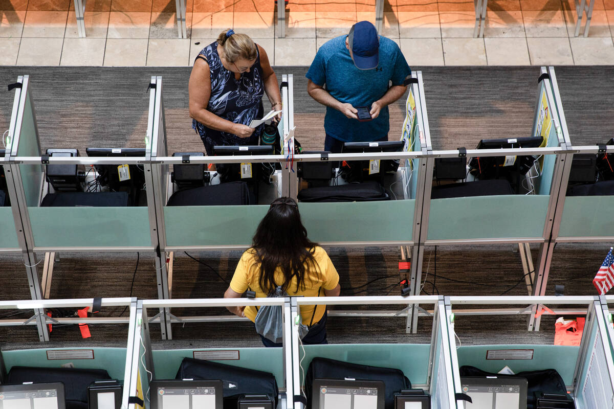 Voters begin to cast their ballots toward the end of the Nevada primary election early voting p ...