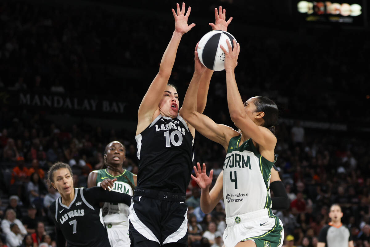 Las Vegas Aces guard Kelsey Plum (10) defends while Seattle Storm guard Skylar Diggins-Smith (4 ...