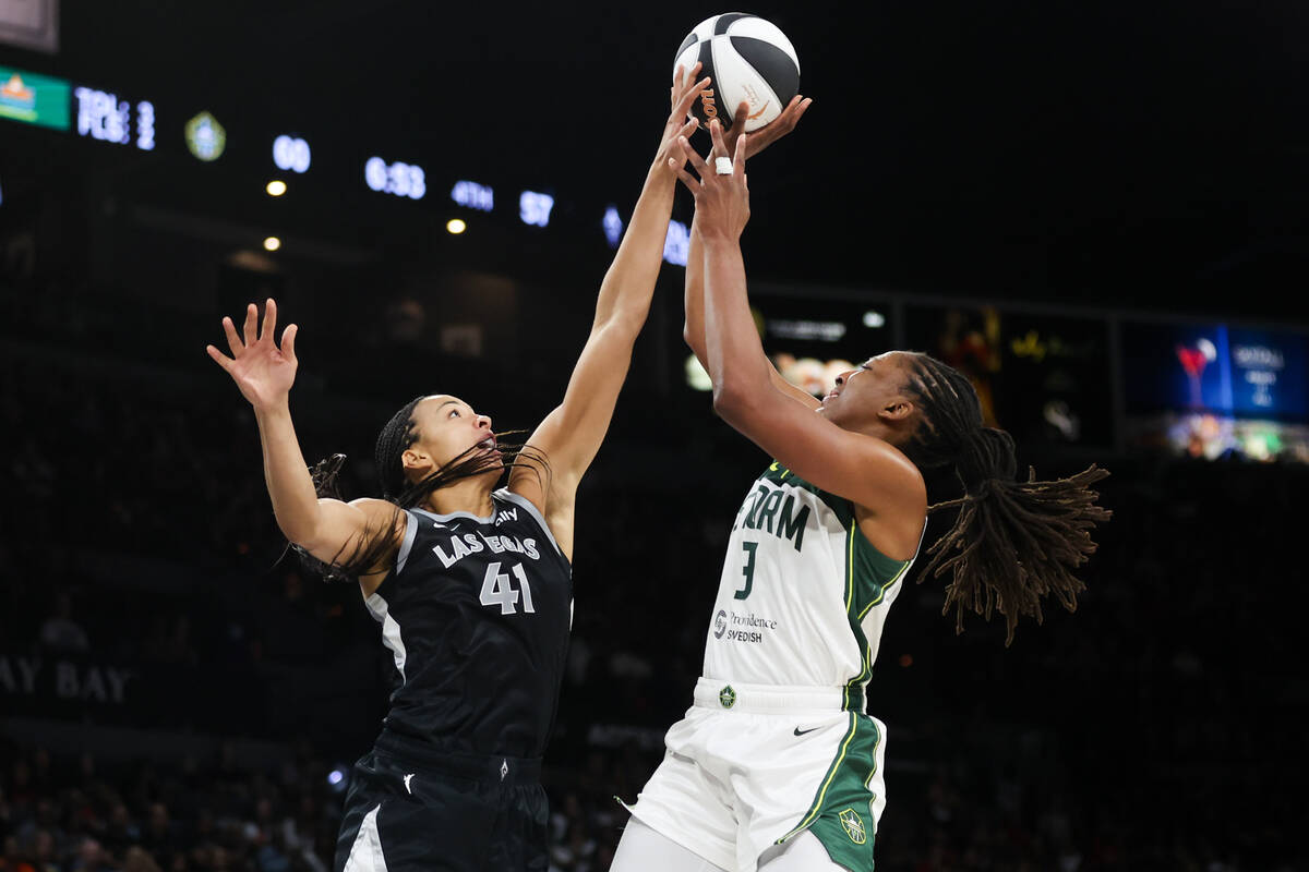 Las Vegas Aces center Kiah Stokes (41) attempts to block a shot by Seattle Storm forward Nneka ...