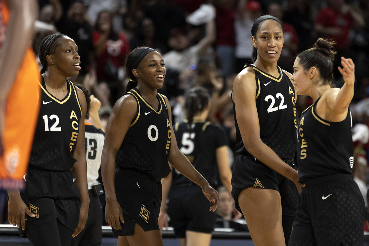 Las Vegas Aces guard Chelsea Gray (12), guard Jackie Young (0), forward A'ja Wilson (22) and gu ...