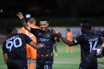 Las Vegas Lights FC’s Khori Bennett (90), Shawn Smart (20) and Solomon Asante (14) celeb ...