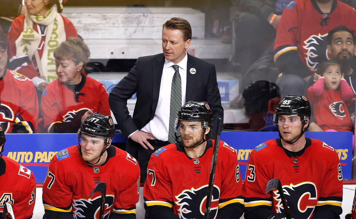Calgary Flames coach Glen Gulutzan watches during the team's NHL hockey game against the Vegas ...