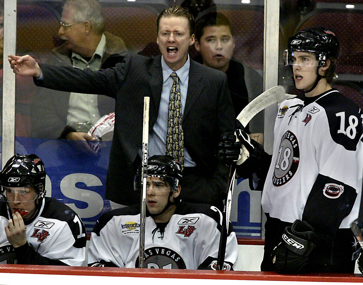 Las Vegas Wranglers hockey coach Glen Gulutzan protests a call during a game against Victoria a ...