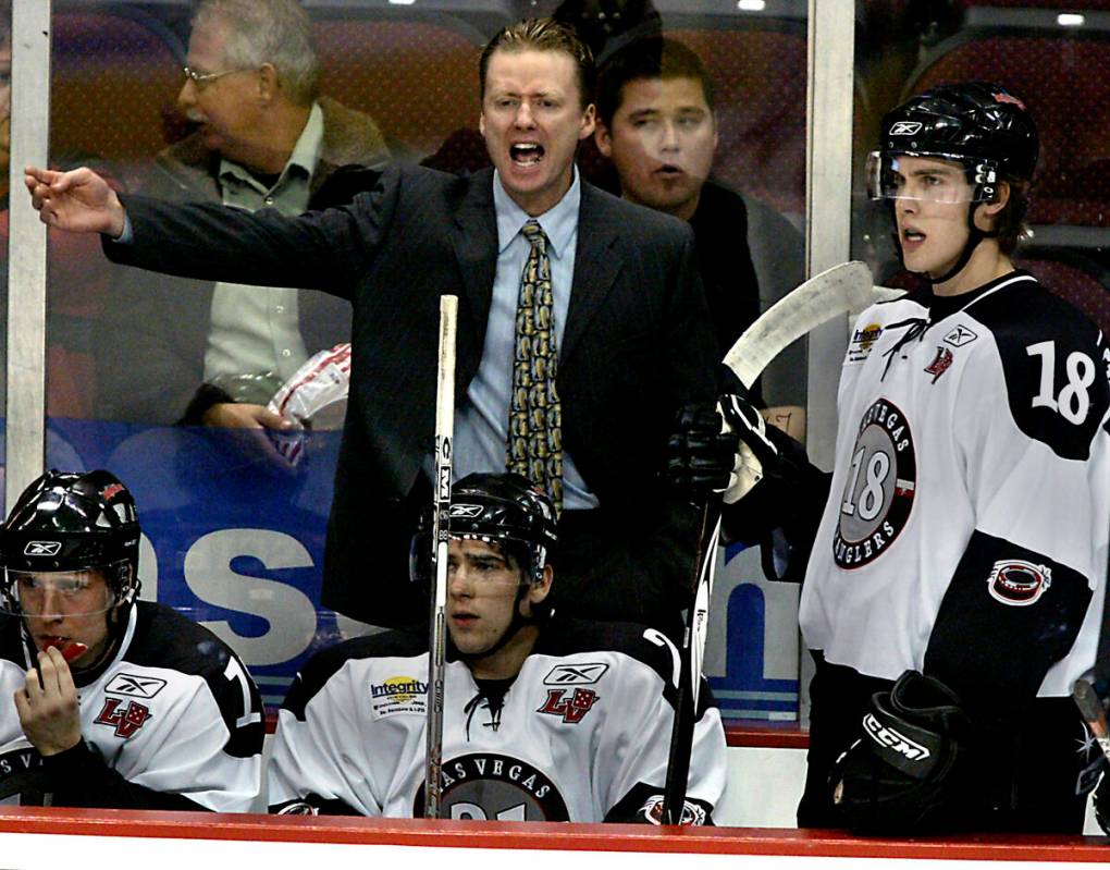 Las Vegas Wranglers hockey coach Glen Gulutzan protests a call during a game against Victoria a ...