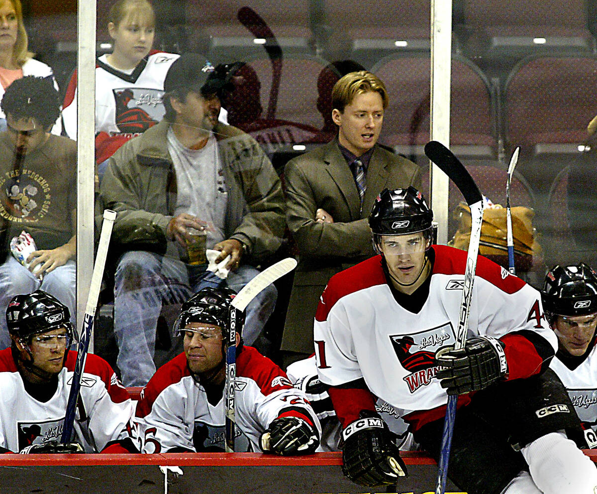 Las Vegas Wranglers coach Glen Gulutzan stands behind his players during a game against Long Be ...