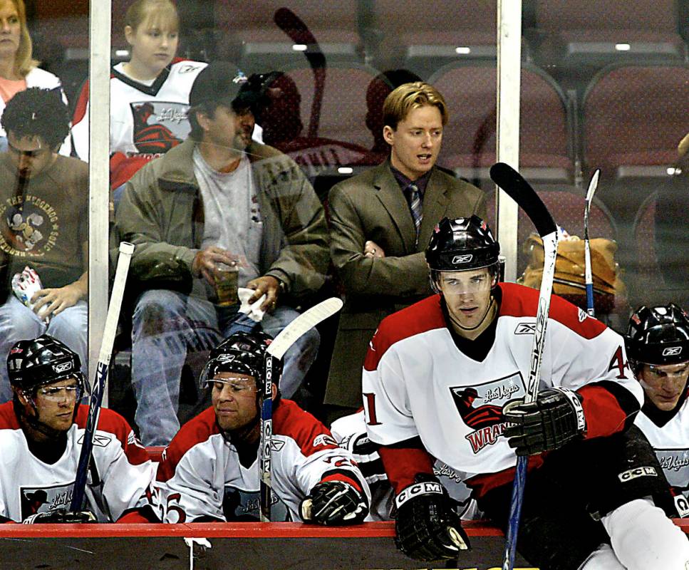 Las Vegas Wranglers coach Glen Gulutzan stands behind his players during a game against Long Be ...