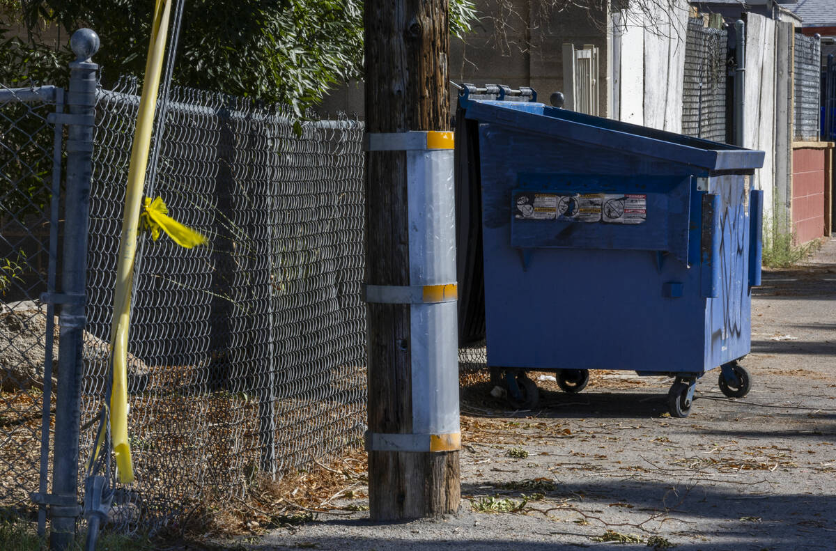 A dumpster and police tape are seen near where 2-year-old Jacoby Robinson Jr. was found on the ...