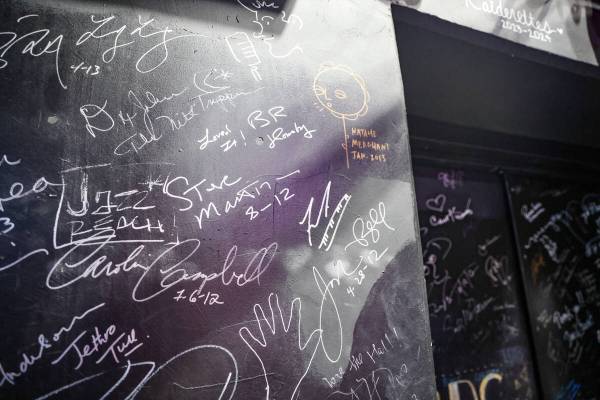 Signatures from stars, including Steve Martin’s, center, adorn the backstage walls at The Smi ...