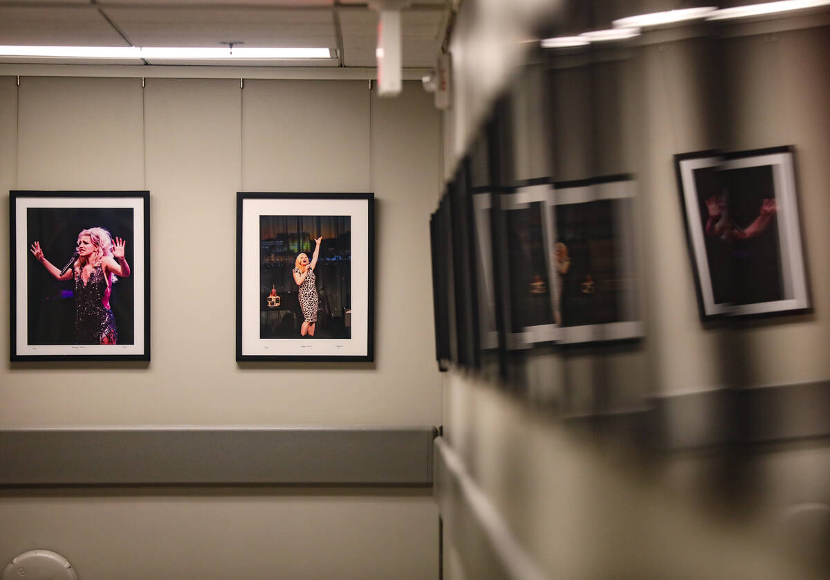 Photos of performers taken by The Smith Center CEO Myron Martin on display in a back hallway at ...