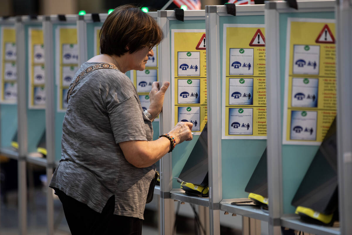 A voter casts their ballot during the Nevada Primary Day Elections on Tuesday, June 11, 2024, a ...