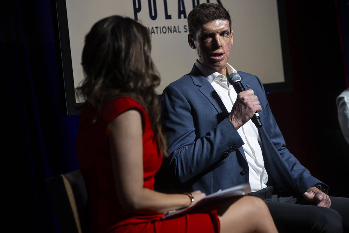 Sam Brown, Republican candidate for U.S. Senate, right, participates in a panel event moderated ...