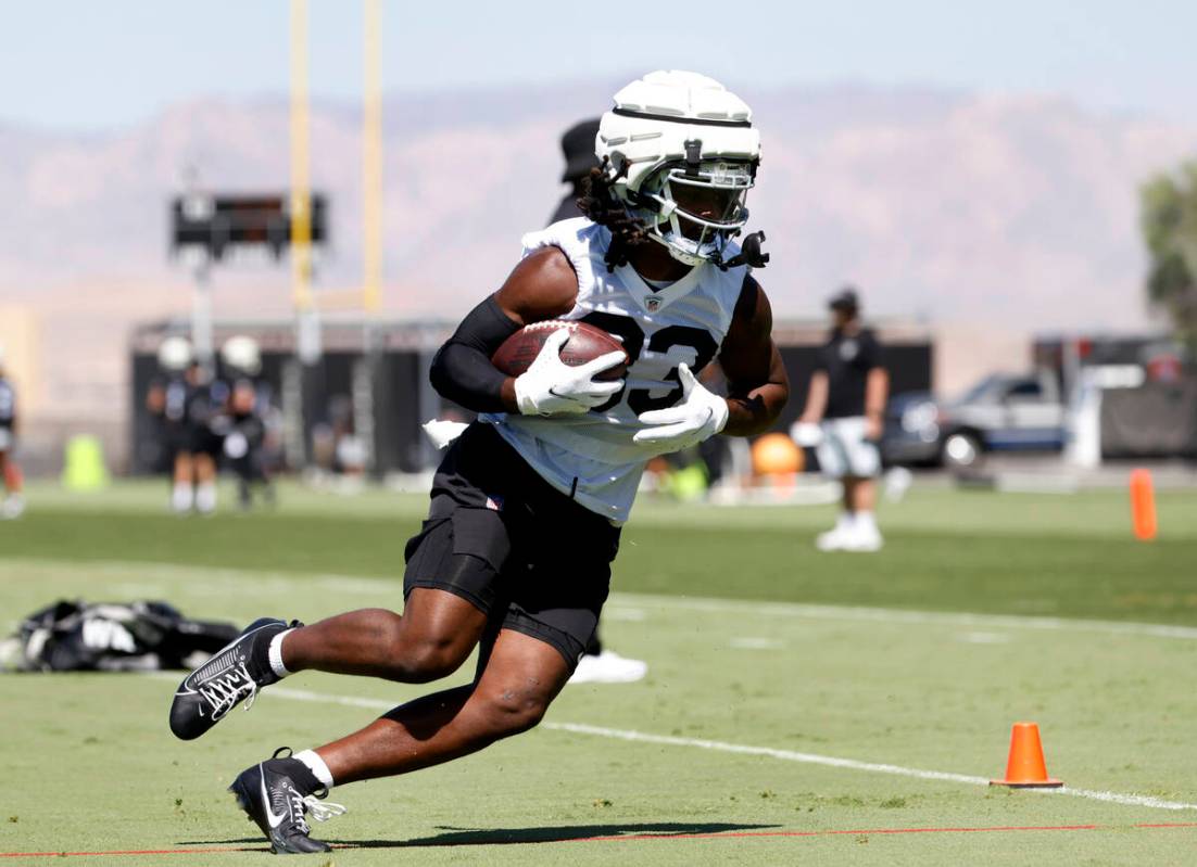 Raiders wide receiver Kristian Wilkerson (83) runs with the ball during an NFL football practic ...