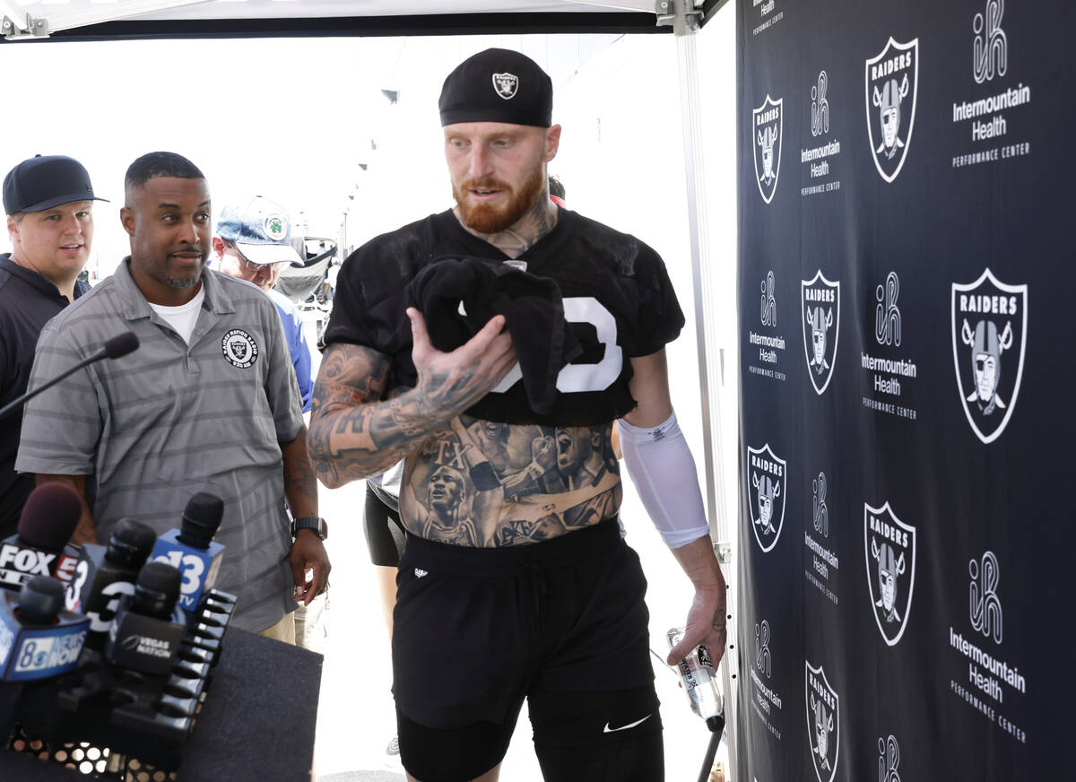 Raiders defensive end Maxx Crosby (98) takes the podium to address the media after an NFL footb ...